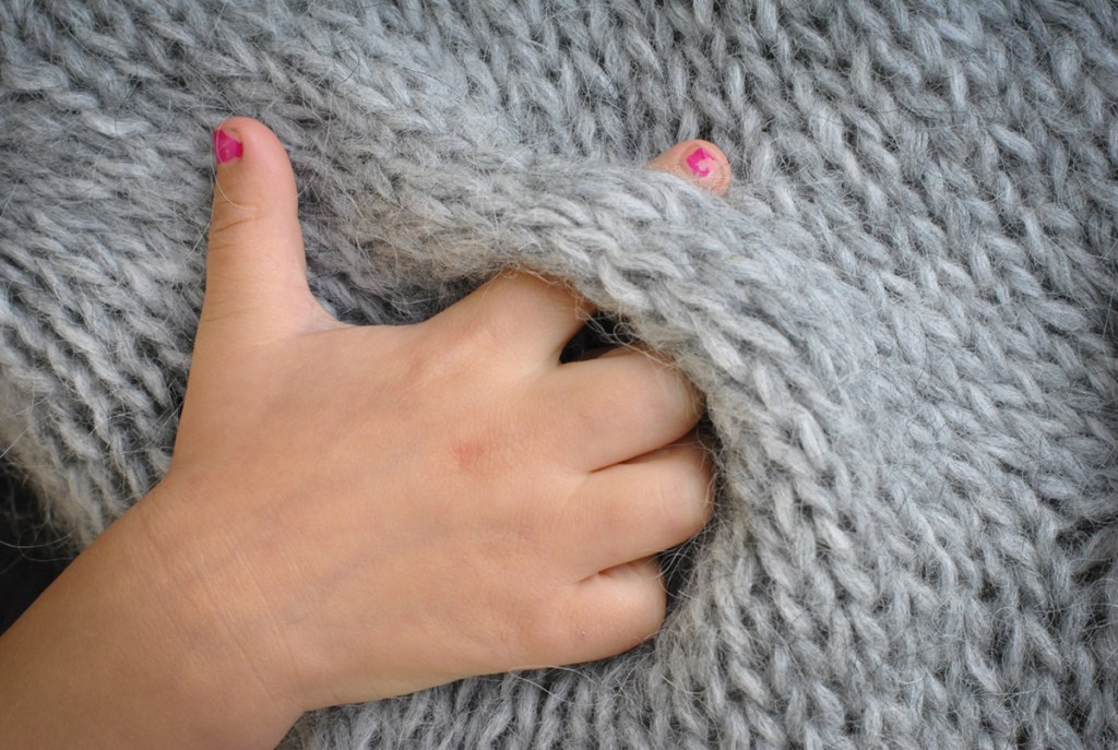 Sastrugi detail with tiny hand