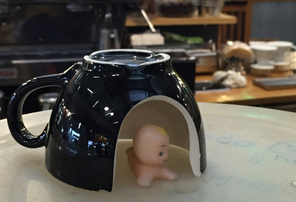 Broken cup or baby igloo? Yes, she happened to have a tiny baby in her purse. We debated hot gluing the thing to some barn wood & selling it on Etsy.