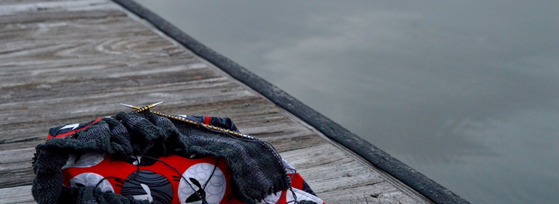 selfish knitting on the dock