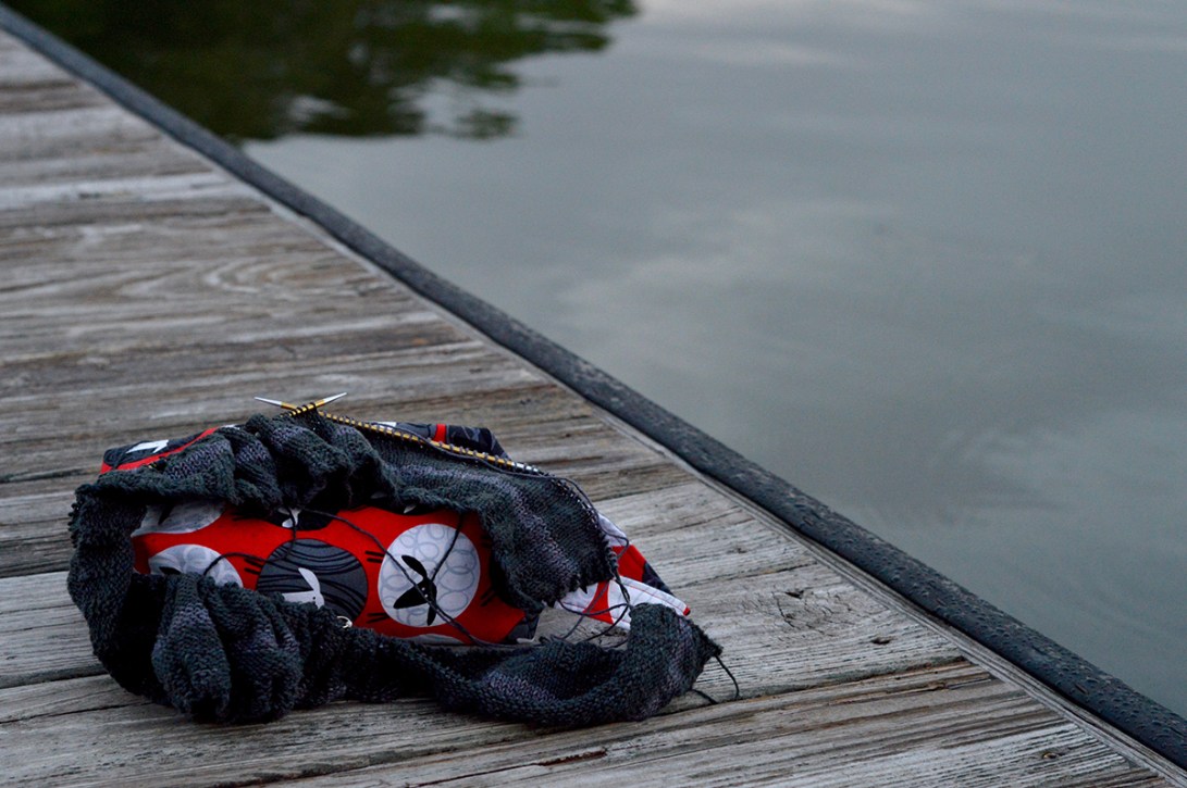 selfish knitting on the dock