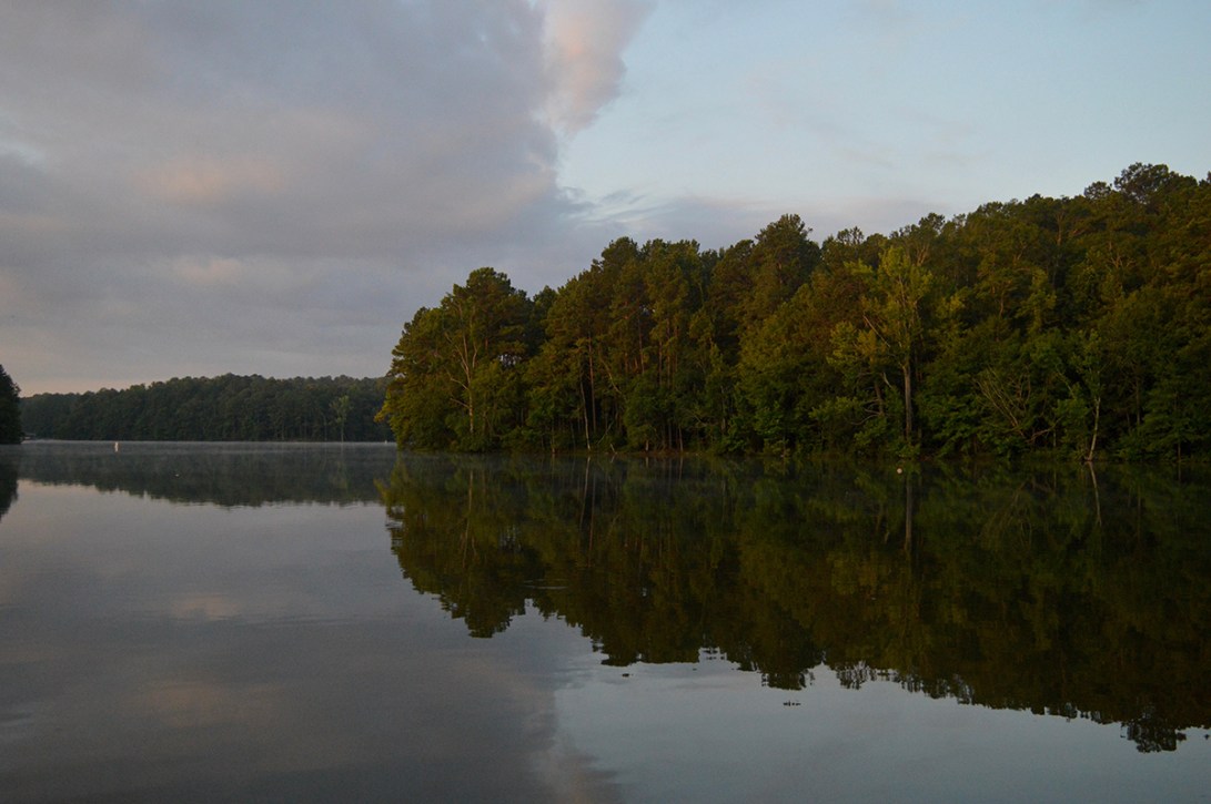 dawn light, trees, clouds, and lake