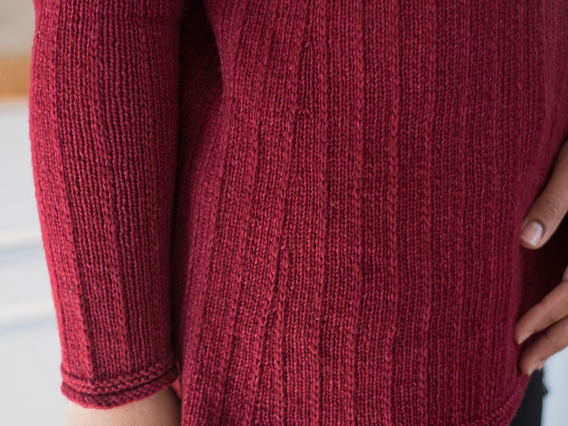Close up of the side shaping and sleeve of the Morning Beach sweater.