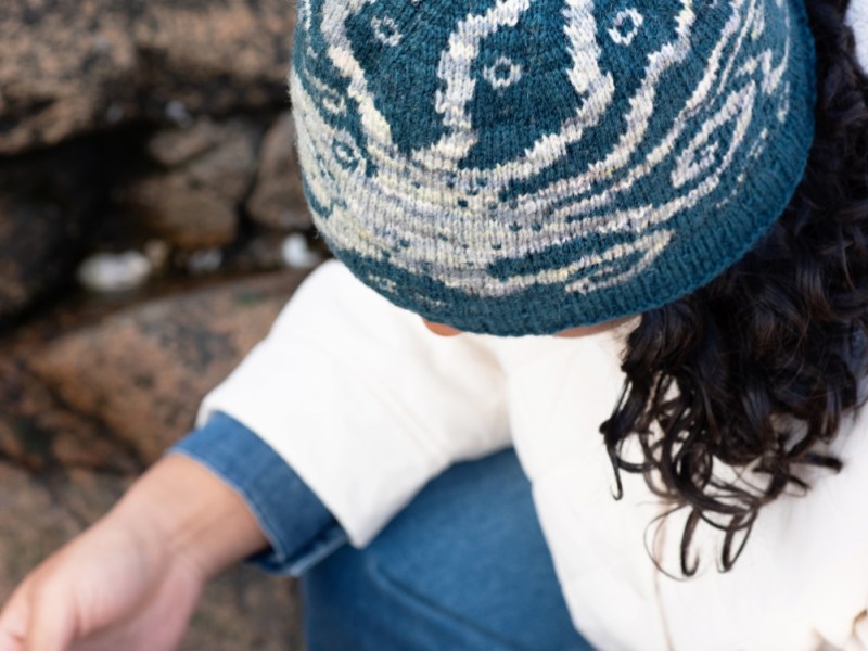 View of the crown of the Enter Octopus hand knit hat, showing wavy tentacles almost meeting at the centre.