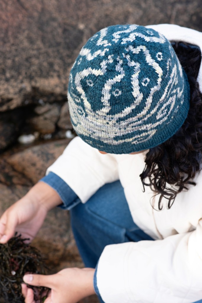 View of the crown of the Enter Octopus hand knit hat, showing wavy tentacles almost meeting at the centre.